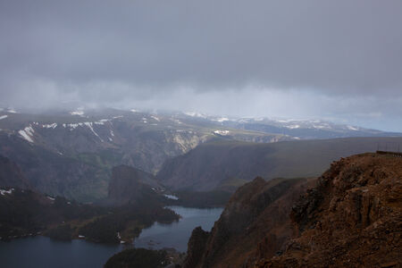 A lake in the Absaroka Mountains under a cloudy sky.の写真素材