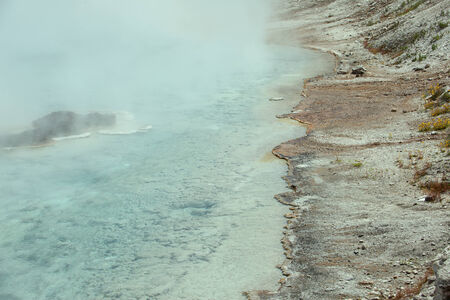 A view of water and bank of a hot spring.の写真素材