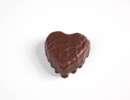 A chocolated heart on a white background.の写真素材