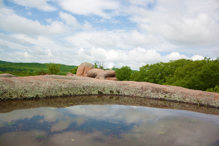 Puddles on boulders at Elephant Rocks State Park.の写真素材