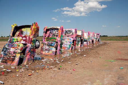 Graffiti cover cars at Cadillac Ranch in Amarillo, Texas on July 13, 2015.のeditorial素材
