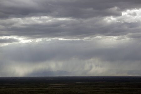 Rain curtaining a view of the mountains.の写真素材