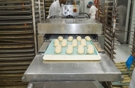 Loaf forming machine in a bakeryの写真素材