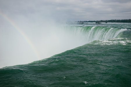 Horseshoe Falls with rainbowの写真素材