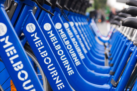 MELBOURNE, AUSTRALIA - AUGUST 16, 2014: Bicycles for hire as part of the Melbourne bike share program. Visitors can hire bikes to explore the city.のeditorial素材