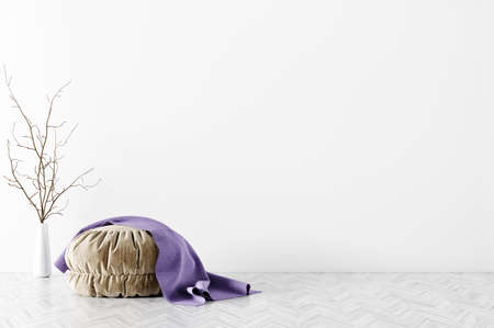 Modern interior of living room with beige pouf and purple plaid on it over white wall 3d renderingの写真素材