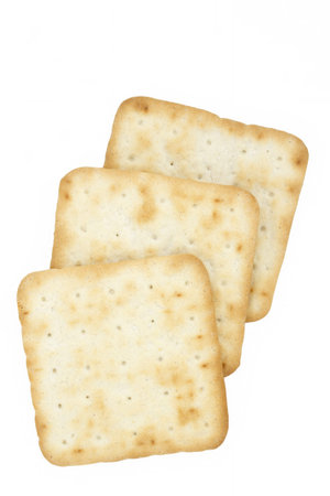 Three cream crackers on a white background