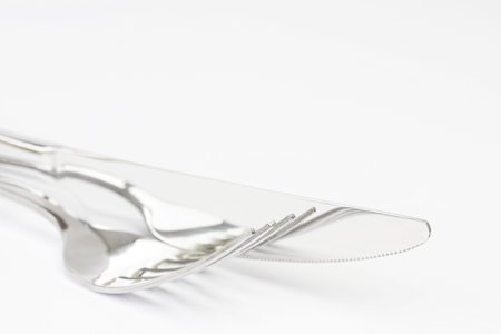 Close up knife and fork on white