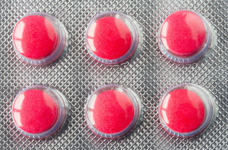 Red pills in a blister pack