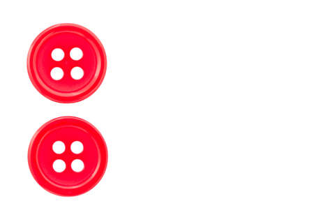 Two red buttons on a white backgroundの写真素材