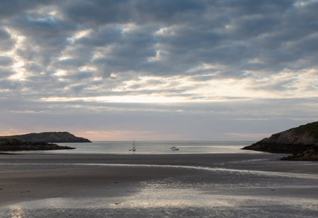 Cemaes Bay beach in Anglesey North Wales at low tide at dusk
