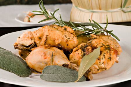 Chicken, stewed in tomato, wine and herb sauce の写真素材