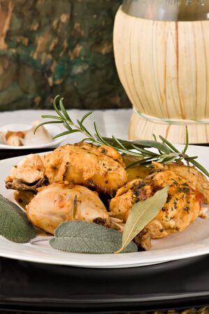 Chicken, stewed in tomato, wine and herb sauce の写真素材