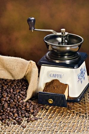 Coffee grinder and roasted coffee beans の写真素材