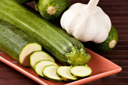 Zucchini  Cucurbita pepo  and Garlic  Allium sativum  の写真素材