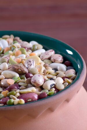 Mix of legumes in an earthenware jarの写真素材