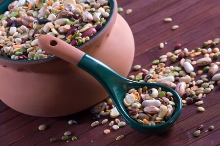 Mix of legumes in an earthenware jarの写真素材