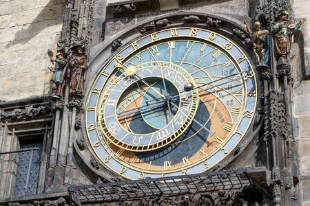 The astronomical clock on the tower of the City Hall, in the old town square in Prague.の写真素材