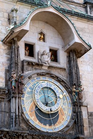 The astronomical clock on the tower of the City Hall, in the old town square in Prague.の写真素材