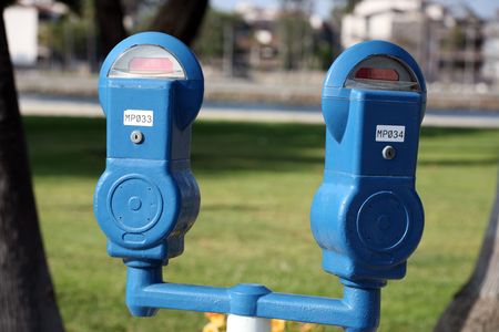 Set of two parking meters at a parkの写真素材