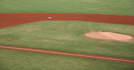 Sports field with grass and dirt infieldの写真素材