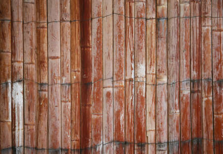 Beautiful exterior wooden fence that has paint splats on it and is weatheredの写真素材