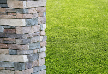 Column or pillar with green grass background at a park