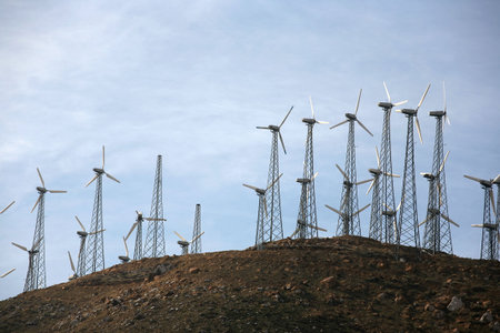 Modern wind energy background with blue sky