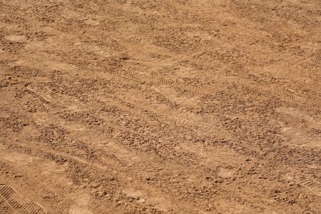 Natural texture background of dirt with footprints Natural texture background of dirt with footprints