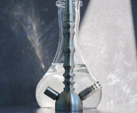 Steel hookah shisha and flask with water on a gray concrete background.の写真素材