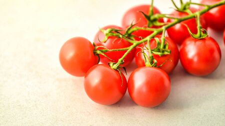 Beautiful red ripe heirloom tomatoes grown in a greenhouse. Gardening photo with copy space. Shallow Depth of Field.の写真素材