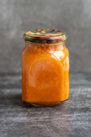 squash caviar in a jar on a black background.の写真素材