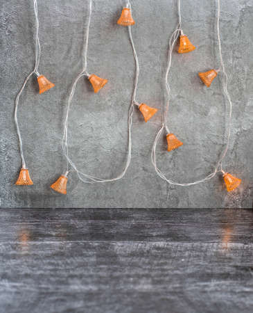 festive gray christmas background with garland lanterns.の写真素材