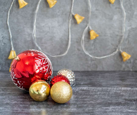christmas wooden gray background with garland lanterns and christmas balls.の写真素材