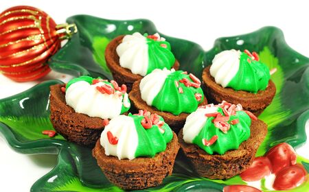 Tasty and decorated brownie on a colorful plate, Christmas decor, red ballの写真素材