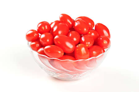 Tasty cherry tomatos in a bowl, white backgroundの写真素材