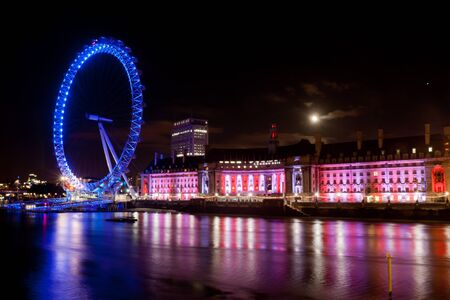London Eye night shot with Thames in frontのeditorial素材