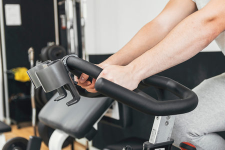 doing cardio on the gym bike. doing exercise