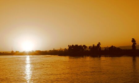 Sunset on the shore of the Nile in sepiaの写真素材