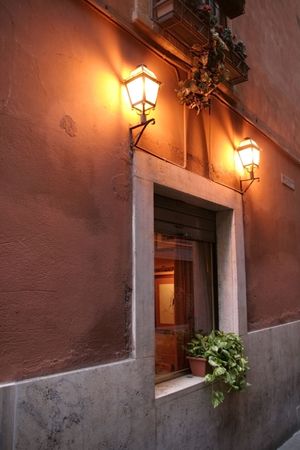 Rome Impression series: Window in Rome lit by two street lanterns above: shot in soft focus for dramatic lighting effectの写真素材