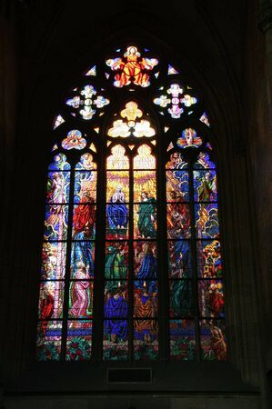 Gothic stained glass window in St. Vitus cathedral in Prague portraying the Pentecostの写真素材