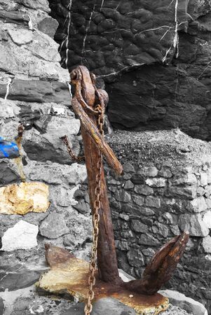 An old anchor on the floorの写真素材