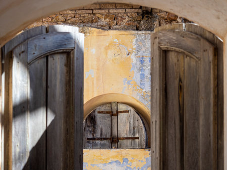 A picture of a rusty window of an abandoned fortressの写真素材