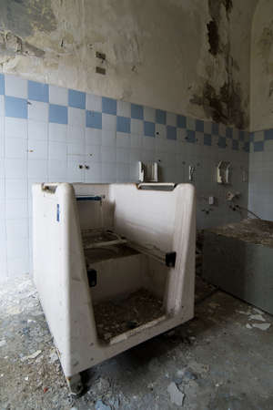 A picture of a bathroom in an abandoned bedlamの写真素材