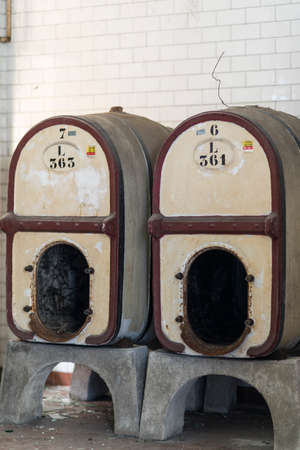 A picture of some abandoned barrels in a scary placeの写真素材