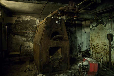 A picture of an old abandoned rusty machineryの写真素材