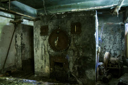 A picture of an old abandoned rusty machineryの写真素材