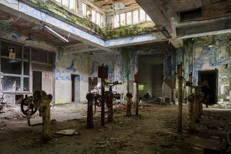 A picture of some abandoned pipes and valvesの写真素材