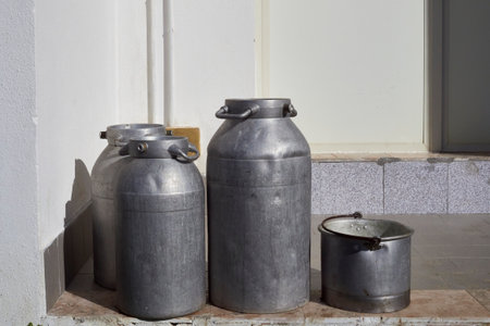 Some milk cans waiting to be taken awayの写真素材