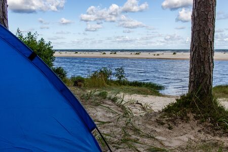 Country side beach view in morning, blue tent in cornerの写真素材